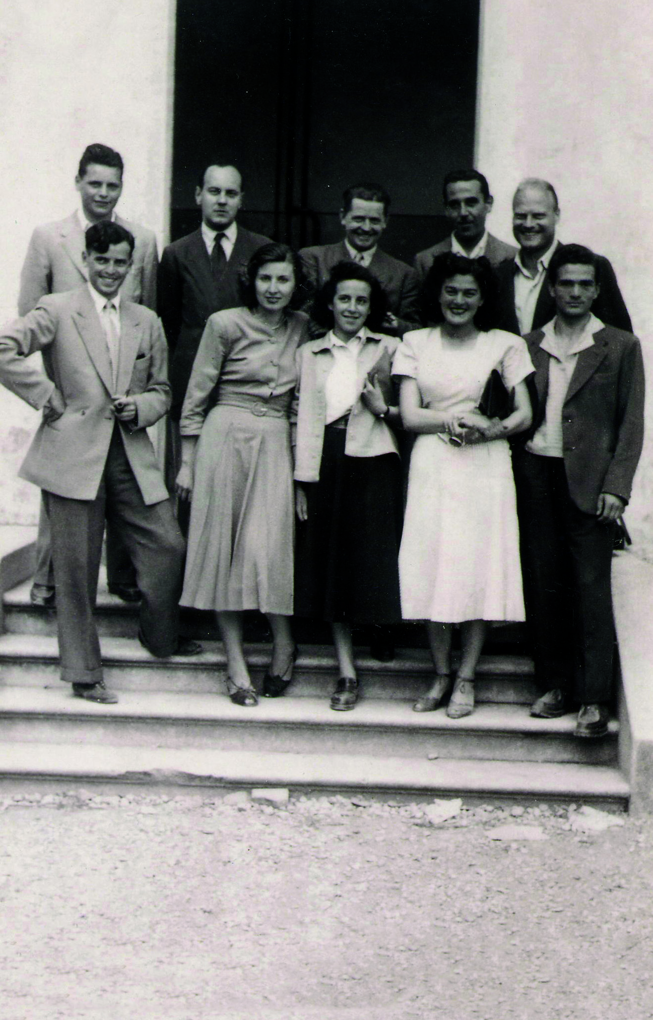 Pasolini (center) as a schoolteacher, surrounded by his students.